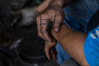 Cropped hands of worker at workshop