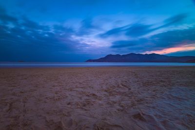 Scenic view of beach against sky during sunset