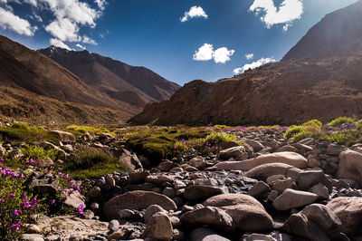 Scenic view of rocks and mountains against sky