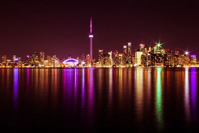 Illuminated buildings in city at night