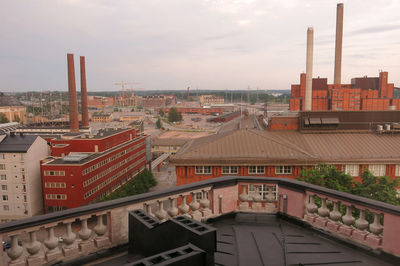 High angle view of buildings in city against sky
