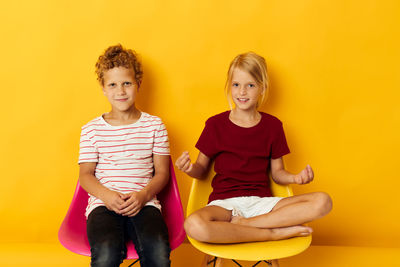 Happy family sitting on sofa at home