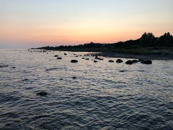 Scenic view of sea against sky during sunset