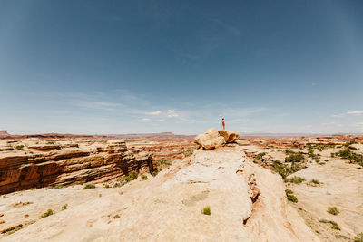 View of rock formations on landscape against sky