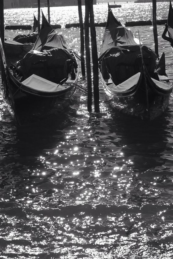 BOATS MOORED IN WATER