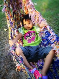 High angle view portrait of boy playing in park