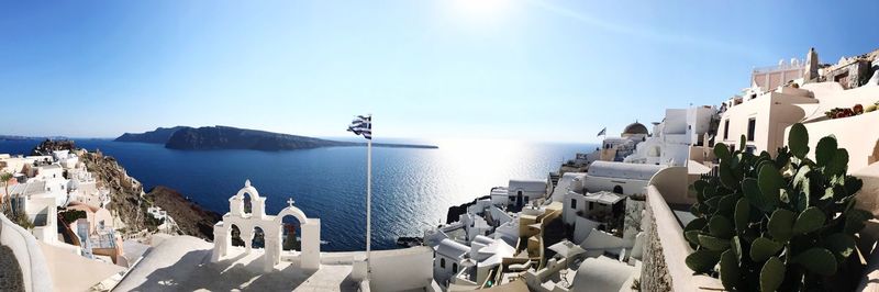 Panoramic view of sea against buildings