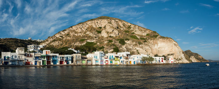 Panoramic view of sea and mountains against sky