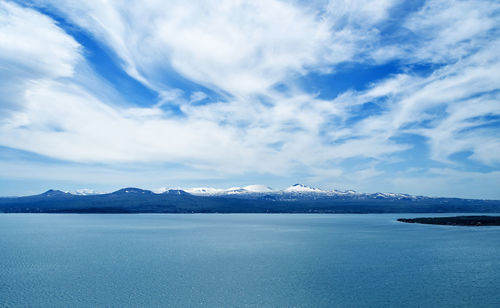 Scenic view of sea against blue sky