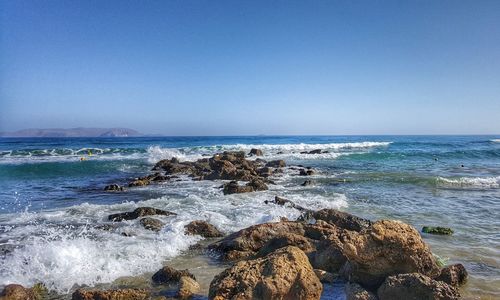 Scenic view of sea against clear blue sky