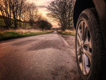 Close-up of car on road