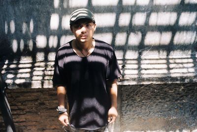 Portrait of young man standing outdoors