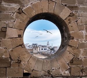 Buildings seen through a round window