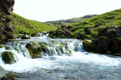 Scenic view of waterfall against clear sky