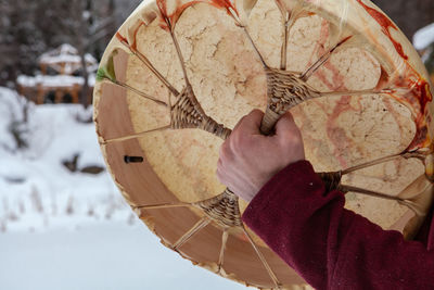 Close-up of person holding umbrella