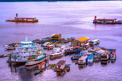 High angle view of boats in sea against sky