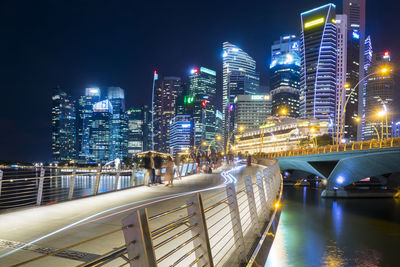 Illuminated modern buildings in city at night