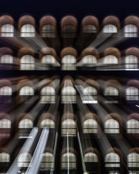 Digital composite image of modern building at night
