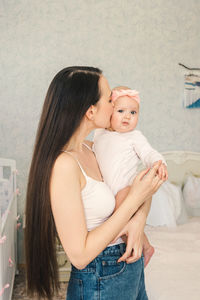 Mother and daughter with hands