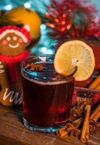 Close-up of drink and gingerbread cookie on table