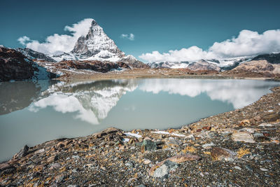 Panoramic view of matterhorn peak, switzerland. matterhorn reflection in the theodul glacier lake.