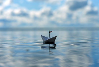 Close-up of paper boat floating on water