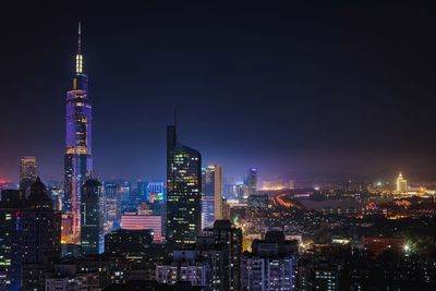 Illuminated buildings in city at night