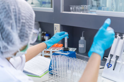 Scientist holding test tube at laboratory