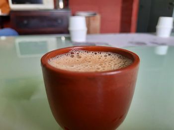 Close-up of coffee cup on table