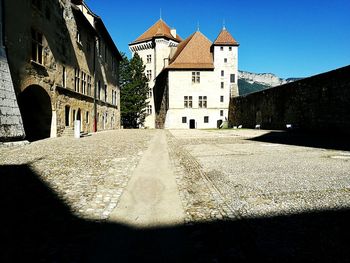 Low angle view of castle against blue sky