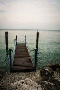 View of pier on calm sea