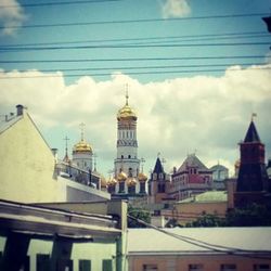 Low angle view of built structure against cloudy sky