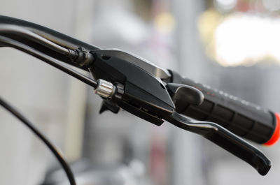 Close-up of bicycle against blurred background