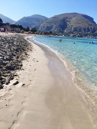 Scenic view of beach against clear sky