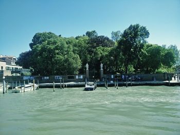 Calm sea with buildings in background