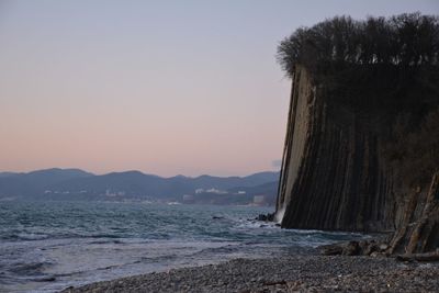 Scenic view of sea against clear sky during sunset