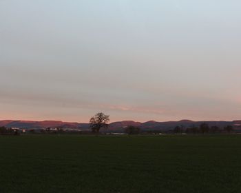 Scenic view of landscape against sky during sunset