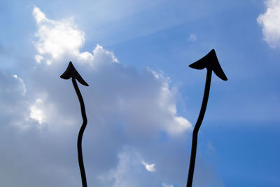 Low angle view of silhouette bird against sky