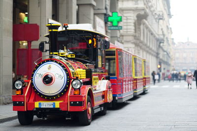 Close-up of motorcycle on street in city