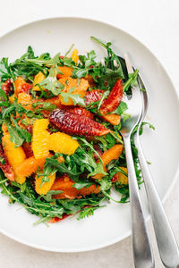 Citrus arugula salad with blood orange, cara cara, and naval oranges