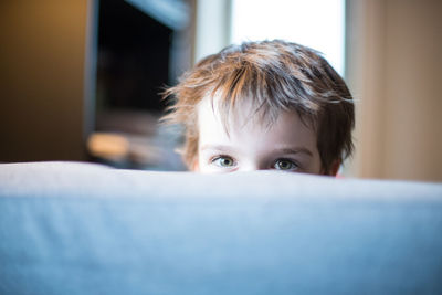 Close-up portrait of boy at home