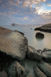 View of calm sea against cloudy sky