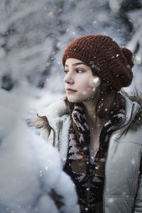 Portrait of a young woman in snow