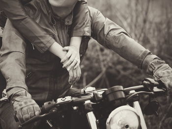 Midsection of man playing motorcycle