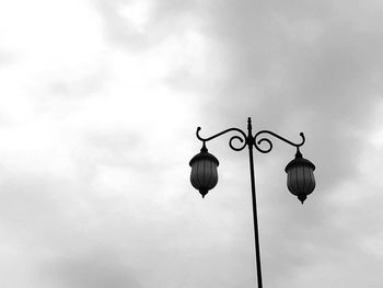 Low angle view of street light against sky