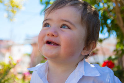 Close-up of thoughtful boy standing outdoors