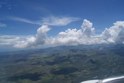 Scenic view of mountains against cloudy sky