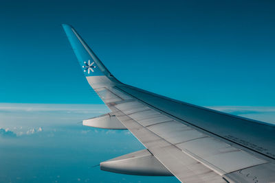 Airplane flying over blue sky