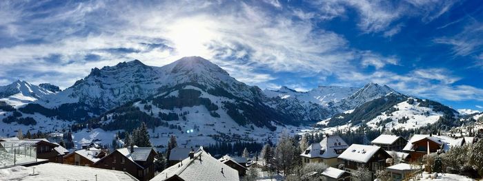 Scenic view of snowcapped mountains against sky