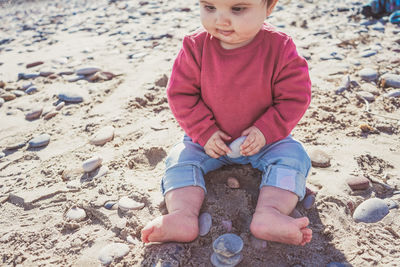 Full length of boy on sand at beach